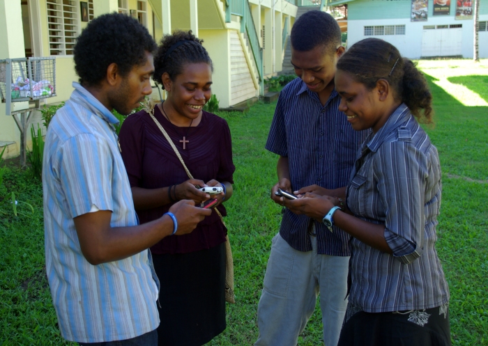 Group_of_young_people_texting_on_mobile_phones._(10699648676).jpg